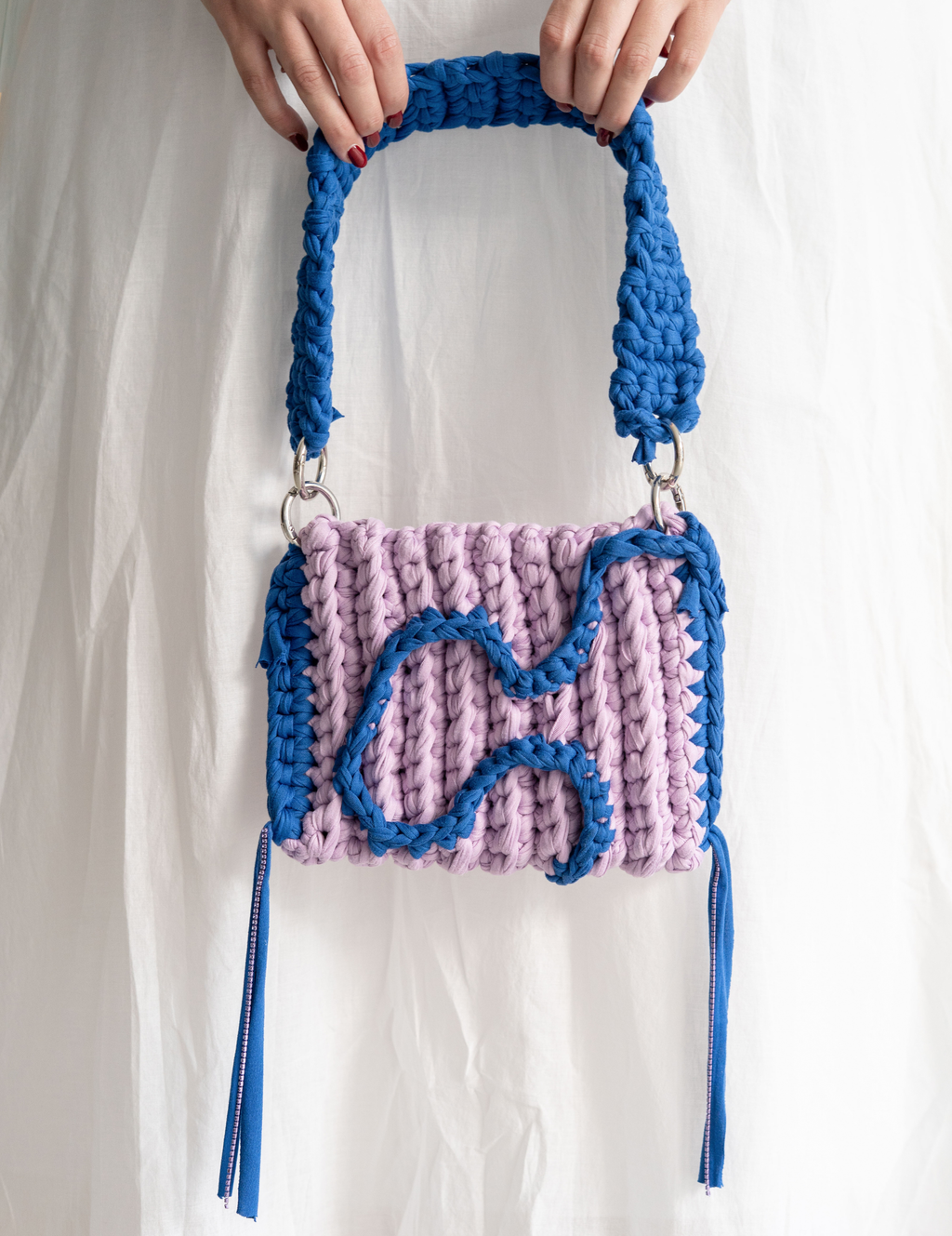bolso brújula lila